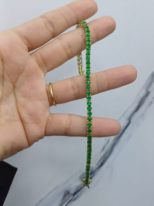 Gold bracelet with emerald
