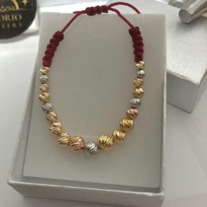 Red bracelet woven with beads