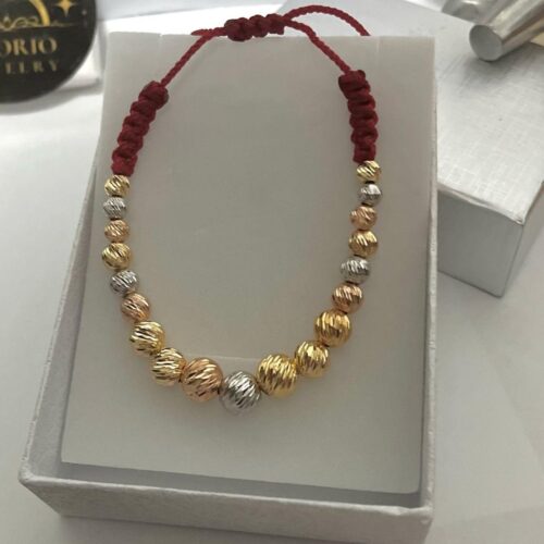 Red bracelet woven with beads